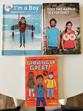 Three books on puberty for boys: one hardcover and two paperbacks. Used.